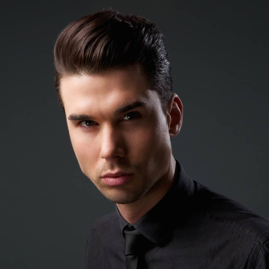 Slicked-back hairstyle with a modern and sleek finish