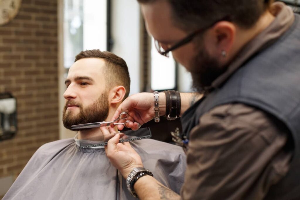 Barber Named Hector Working on a Client’s Hair