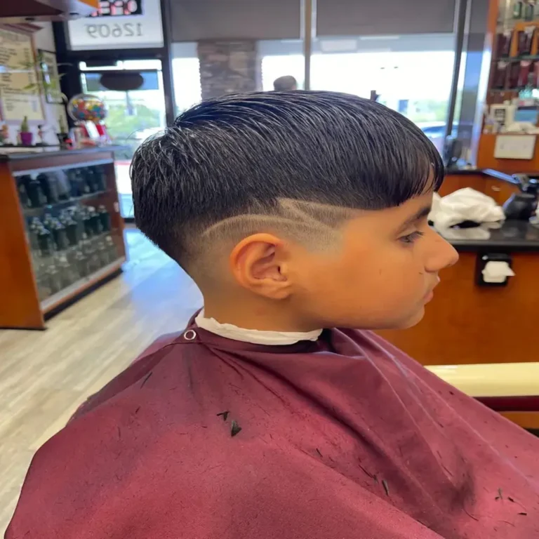 Close-up of a barber giving a precision haircut