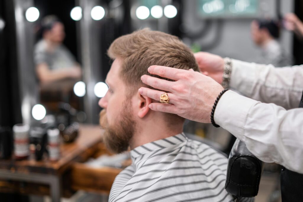 A satisfied client smiling after a haircut